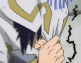 a close up of a person covering their face with their hand .