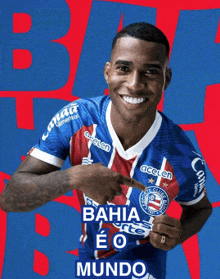 a man in a bahia eo mundo soccer jersey