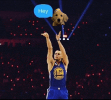 a basketball player in a golden state warriors jersey throws a dog in the air