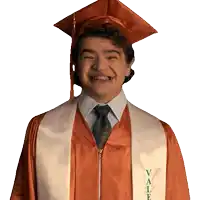 a man wearing a graduation cap and gown with vale on the front