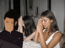 a man and two women are praying with their hands folded