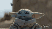 a baby yoda from the mandalorian is on a disney+ advertisement