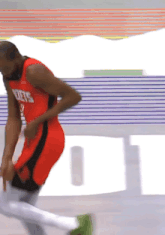 a basketball player wearing a jersey that says rockets on it