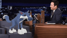a man in a suit sits at a desk with a cartoon dog standing next to him