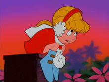 a cartoon character with a flower in her ear is sitting on a box