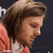 a close up of a man 's face with the website chess.com visible