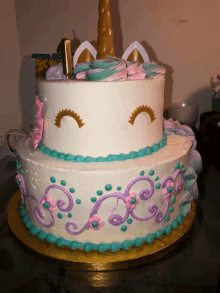 a cake with a unicorn on top and the number 1 on the top