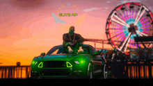 a man sits on top of a green car in front of a ferris wheel that says elite rp on it