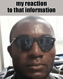 a man wearing sunglasses with the caption `` my reaction to that information ''