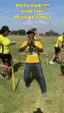 a man in a yellow shirt is standing on a field with the words potcova for the reggae girlz written above him