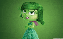 a green cartoon character with a purple scarf around her neck is standing with her arms crossed