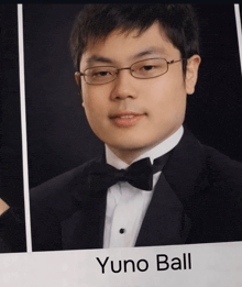 a man in a tuxedo and bow tie has yuno ball written on the bottom