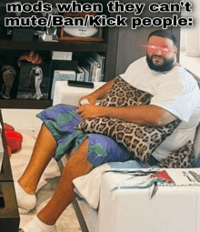 a man is sitting on a couch with a caption that says mods when they can 't mute