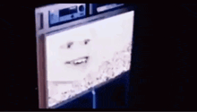 a yellow smiley face is being displayed on a computer screen .