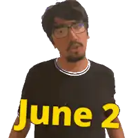 a man wearing glasses and a black shirt with the word june 2 on it