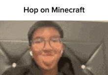 a man wearing glasses is making a funny face with the words hop on minecraft written above him .