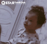 a star tamil chat sticker of a baby looking at something