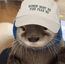 a otter wearing a hat that says women want me fish fear me