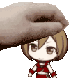 a hand is petting a small cartoon character on the head .