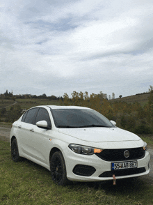 a white car with a license plate that says 55-ab-887