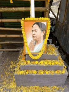 a picture of a woman surrounded by yellow flowers on a pedestal