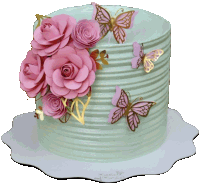 a blue cake with pink roses and butterflies on top