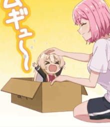a girl with pink hair is petting a child in a cardboard box