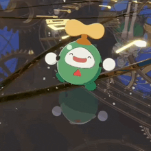 a green cartoon character with a propeller on top of it is flying through the air .