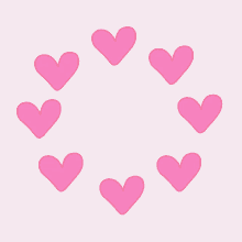 a circle of pink hearts on a light pink background