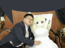 a man in a suit and tie is holding a pillow with a picture of a bride on it .