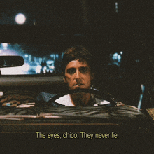 a man in a car with the words " the eyes chico they never lie "