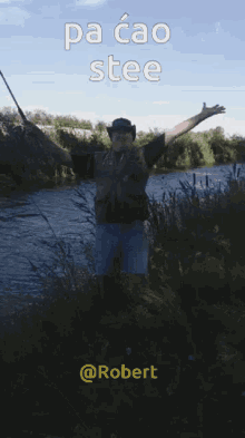 a man in a cowboy hat is holding a fishing rod in front of a river with the caption pa cao stee