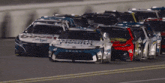 a group of racing cars with one that says camry on the front