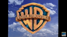 a logo for warner home video against a cloudy sky