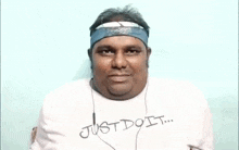 a man wearing a headband and a white shirt with the words ' ragadi pilot batch ' written on it