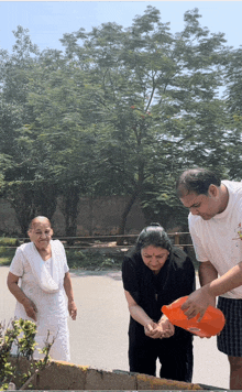 a man pours water into a woman 's hands