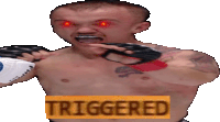 a shirtless boxer with red eyes and the word triggered in the corner