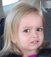 a little girl with blonde hair is making a serious face