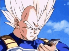 vegeta from dragon ball z is holding a cell phone in his hand .