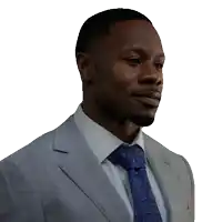 a man in a suit and tie looks to his right