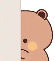 a brown teddy bear peeking out from behind a wall .