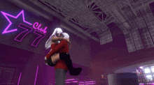 a man carrying a woman in his arms in front of a club 77 sign