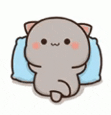 a cute cartoon cat is laying on a pillow .