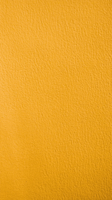 a close up of a yellow paper texture