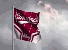 a red and white flag with the word gancock on it