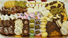 a tray filled with a variety of cookies including santa claus