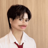 a person wearing a white shirt and a red tie has a big mouth