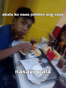 a boy and a girl are sitting at a table eating food with a caption that reads " nasayo pala "