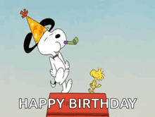 snoopy is wearing a party hat and blowing a party horn while woodstock is standing on a box .