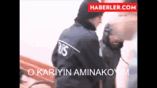 a man in a police uniform is being held by another man with the words o karyin aminakoyim on the bottom